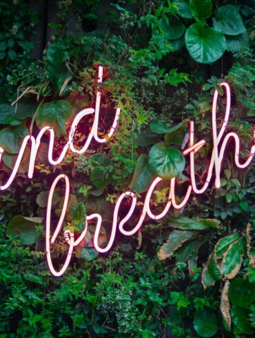 and breathe neon sign on tre