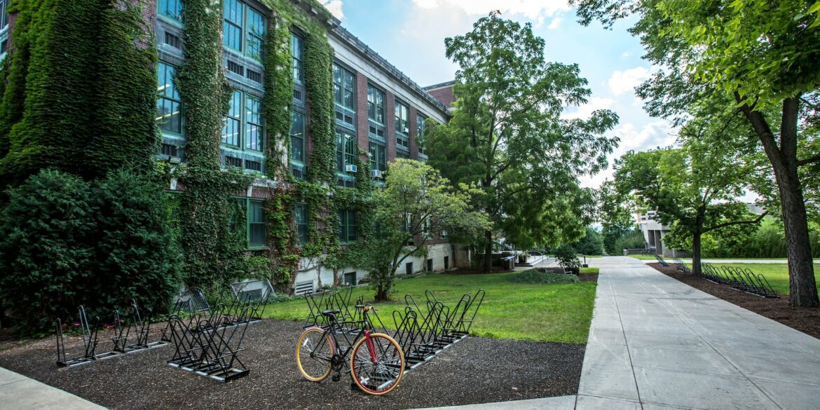black bicycle parked in front of building