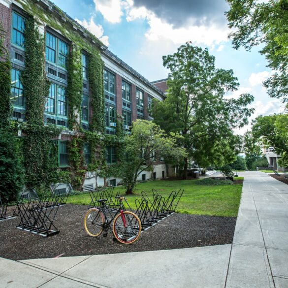 black bicycle parked in front of building