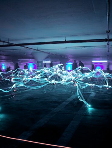 linked neon lights under white painted basement
