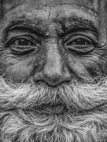 grayscale photo of mans face