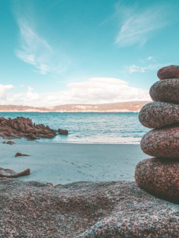 gray rocks on seashore during daytime