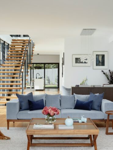 brown wooden coffee table near gray couch