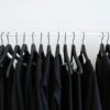 black clothes hanged in rack