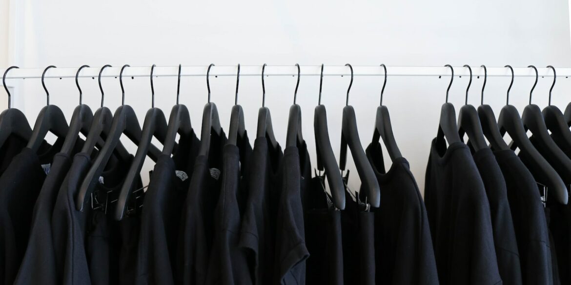 black clothes hanged in rack