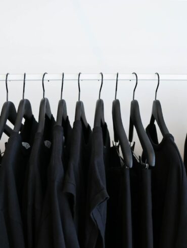 black clothes hanged in rack