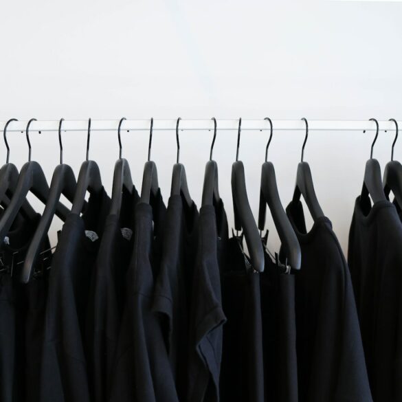 black clothes hanged in rack