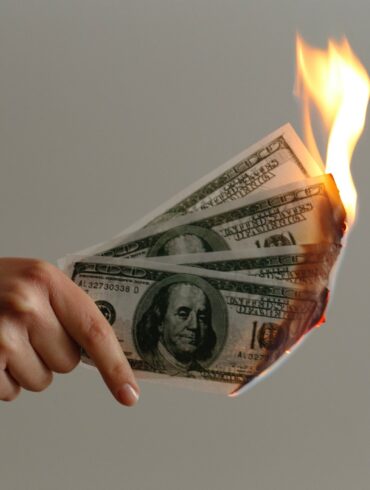 burned 100 US dollar banknotes