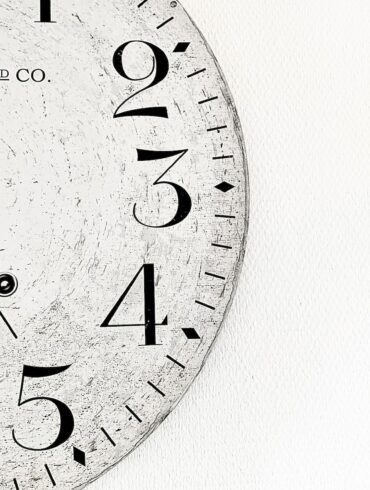 white analog wall clock at 10 00