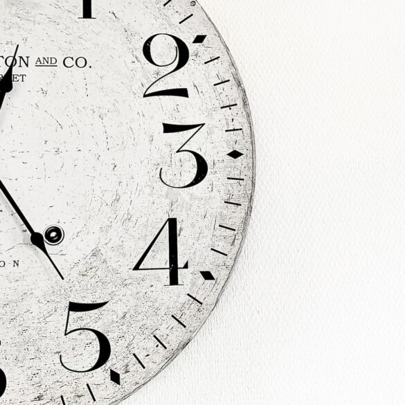 white analog wall clock at 10 00