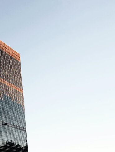 low angle photo of curtain wall building at daytime
