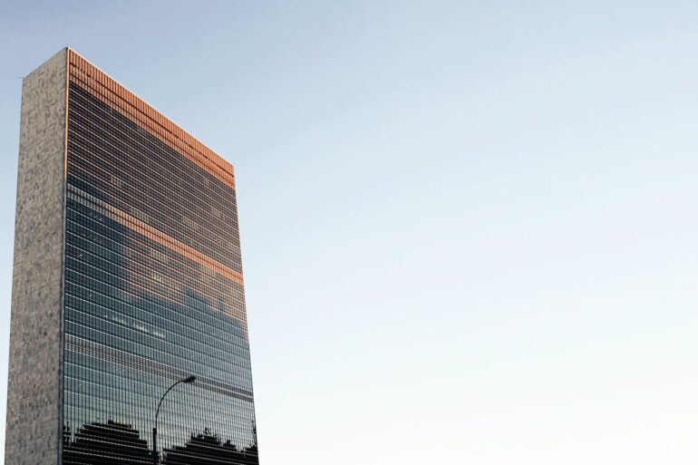 low angle photo of curtain wall building at daytime