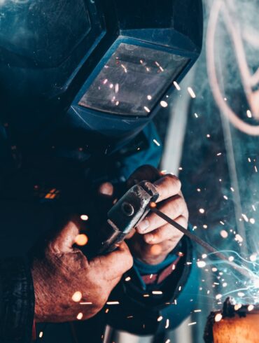 man using welding machine