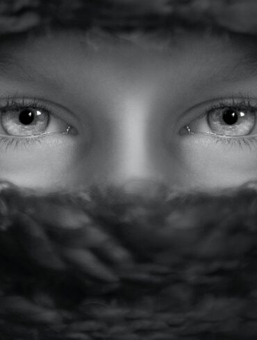 grayscale shot of person's eyes