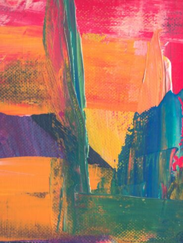 green, yellow, and red abstract painting