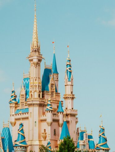 a castle with blue and white spires
