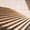 toddler's standing in front of beige concrete stair