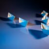 white paper boats on white surface