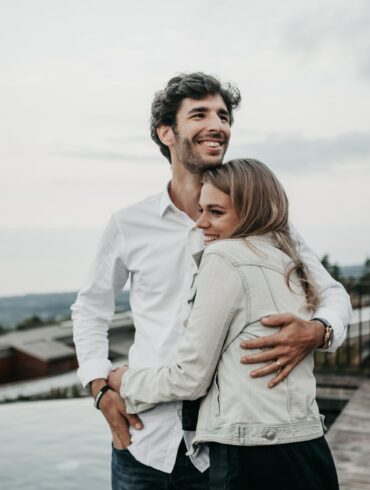 man and woman hugging each other