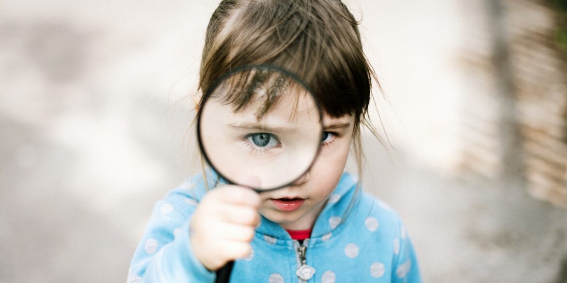 girl in blue and white polka dot jacket