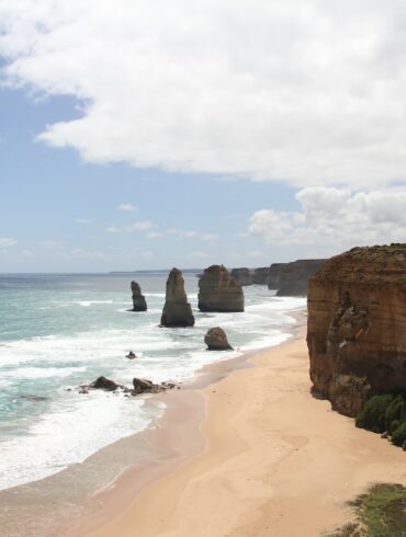 brown rock formation on sea shore during daytime