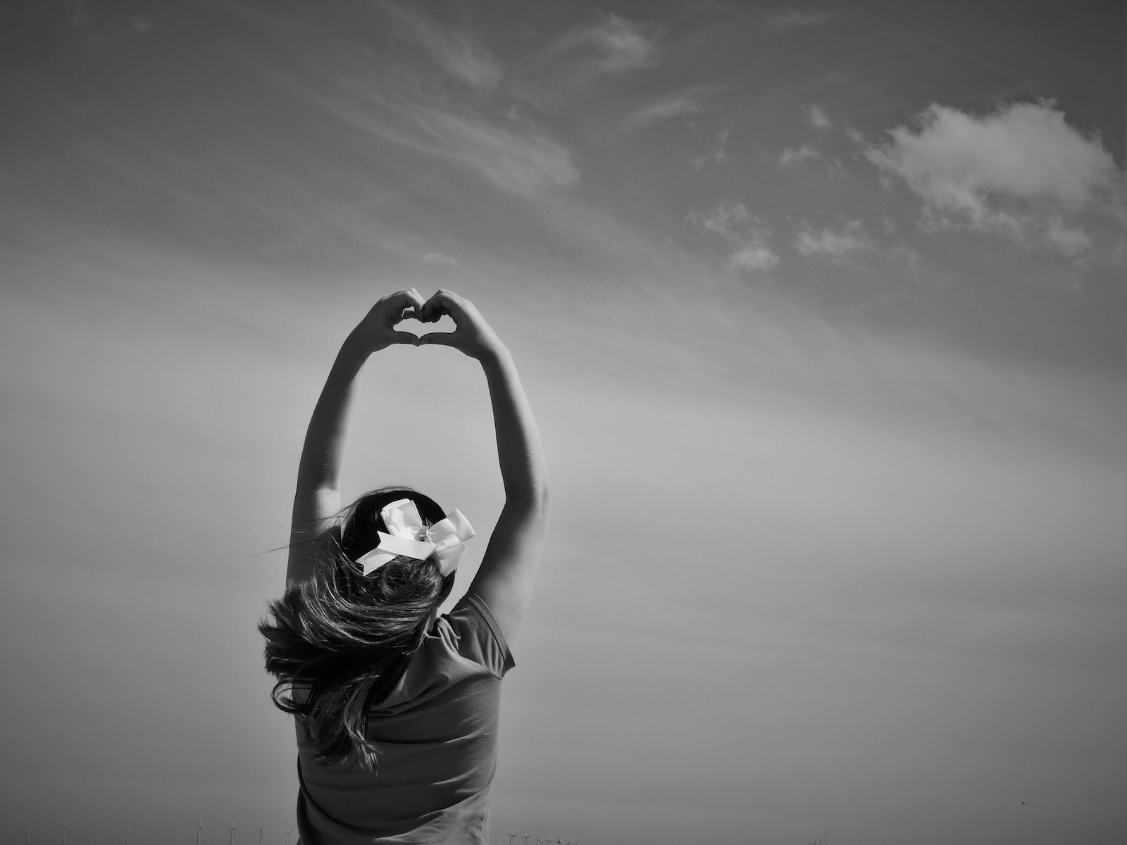 woman making heart shape on her hards