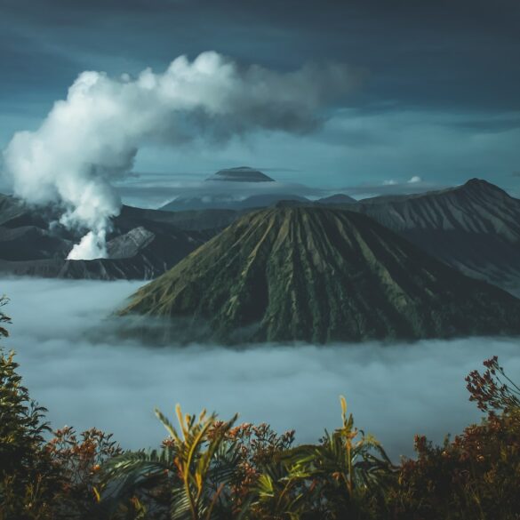 green mountains surrounded by white clouds