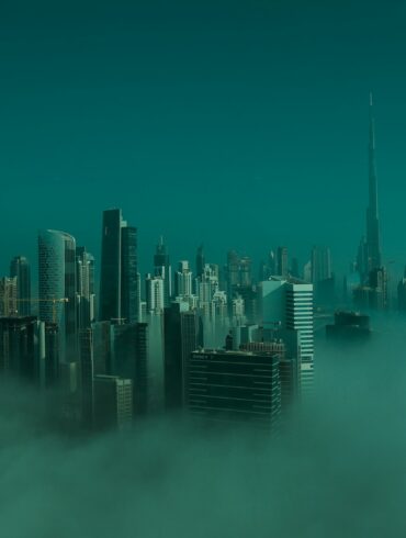 city skyline under blue sky during daytime