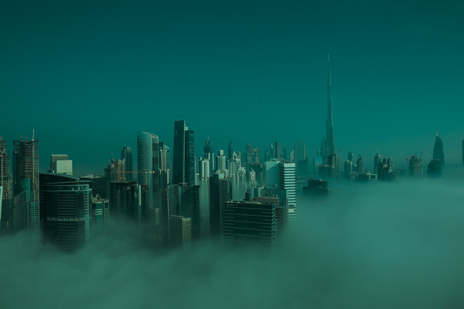 city skyline under blue sky during daytime