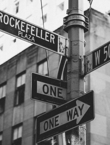 greyscale photo of street signage