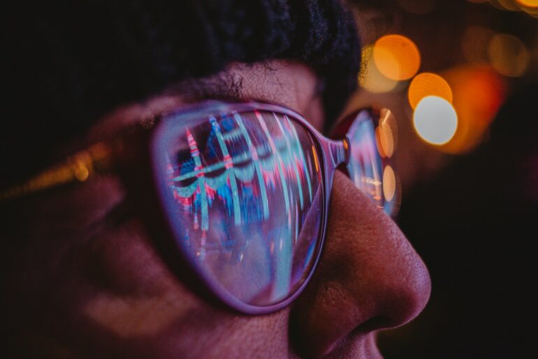 a close up of a person wearing sunglasses