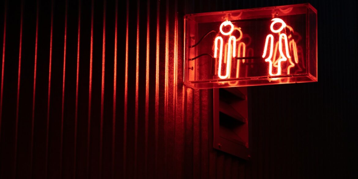 a red sign with a white symbol