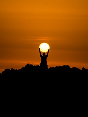 silhouette of person holding dun