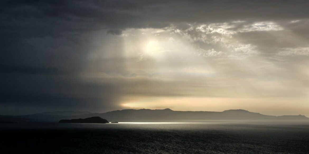 body of water under cloudy sky during daytime