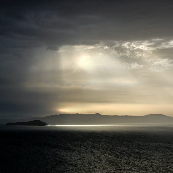 body of water under cloudy sky during daytime