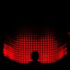 a person standing in front of a red light