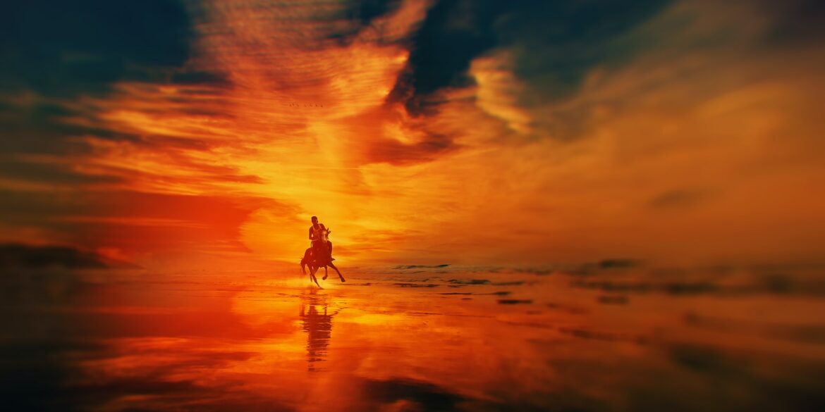 silhouette of man riding a horse