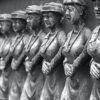grayscale photo of man and woman statue