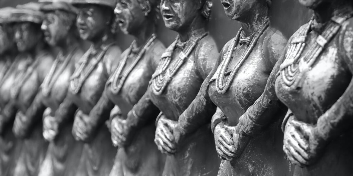 grayscale photo of man and woman statue