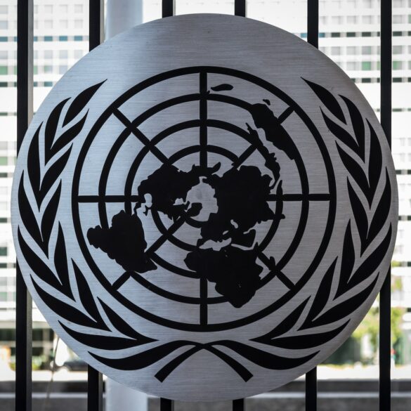 the united nations emblem is on display in front of a window
