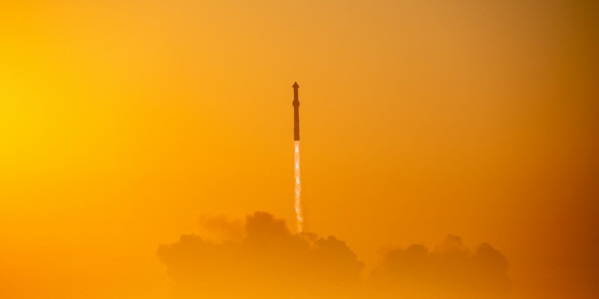 a rocket is flying through the air on a foggy day