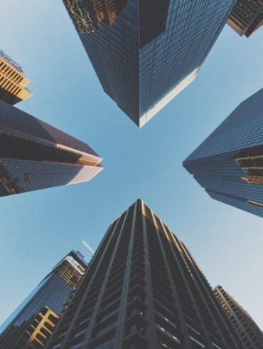 blue and black city buildings photography