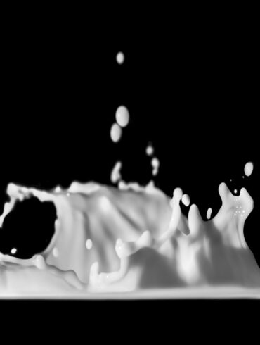 a black and white photo of a liquid splash