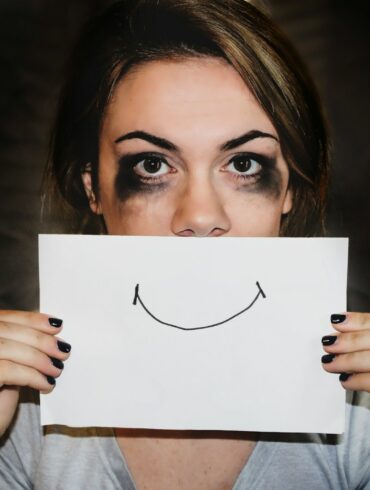 person holding white printer paper