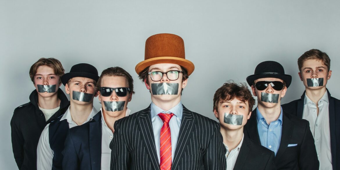 a group of people with duct tape on their faces