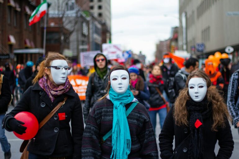 a group of people walking down a street