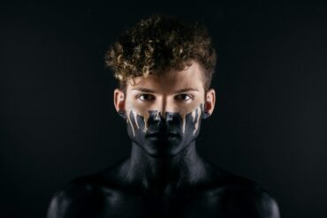 man with black body paint