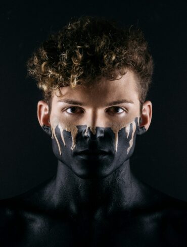 man with black body paint
