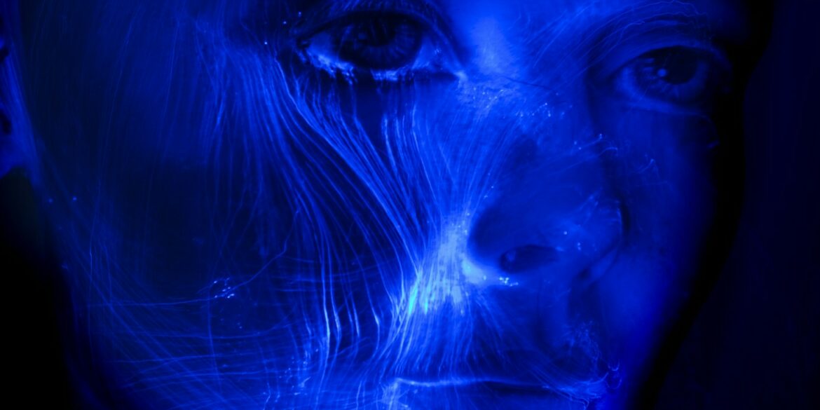 womans face with blue light