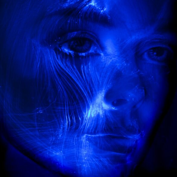 womans face with blue light